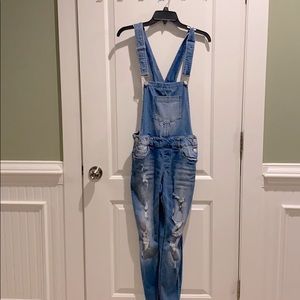 light ripped jean overalls